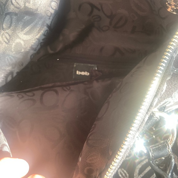 I am selling my BEBE purse it’s very unique I’ve never used it once - Picture 8 of 8